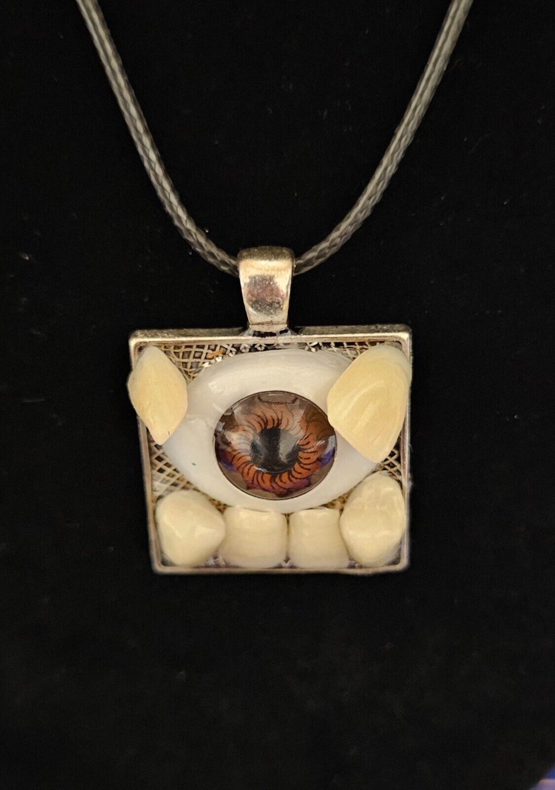 Handcrafted Artisan Necklace Resin Teeth and Doll Eye Charm